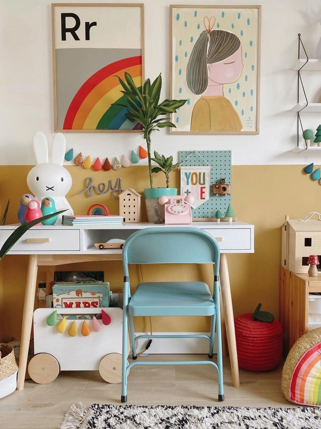 Rainbow wall print above desk in kids bedroom
