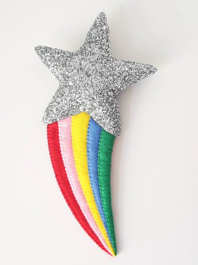 Silver glitter shooting star with a rainbow tail