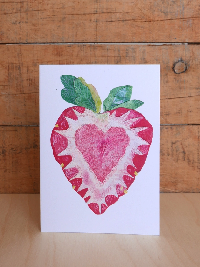 The front of Strawberry Heart Card. Illustration of a slice of strawberry with a heart in the centre