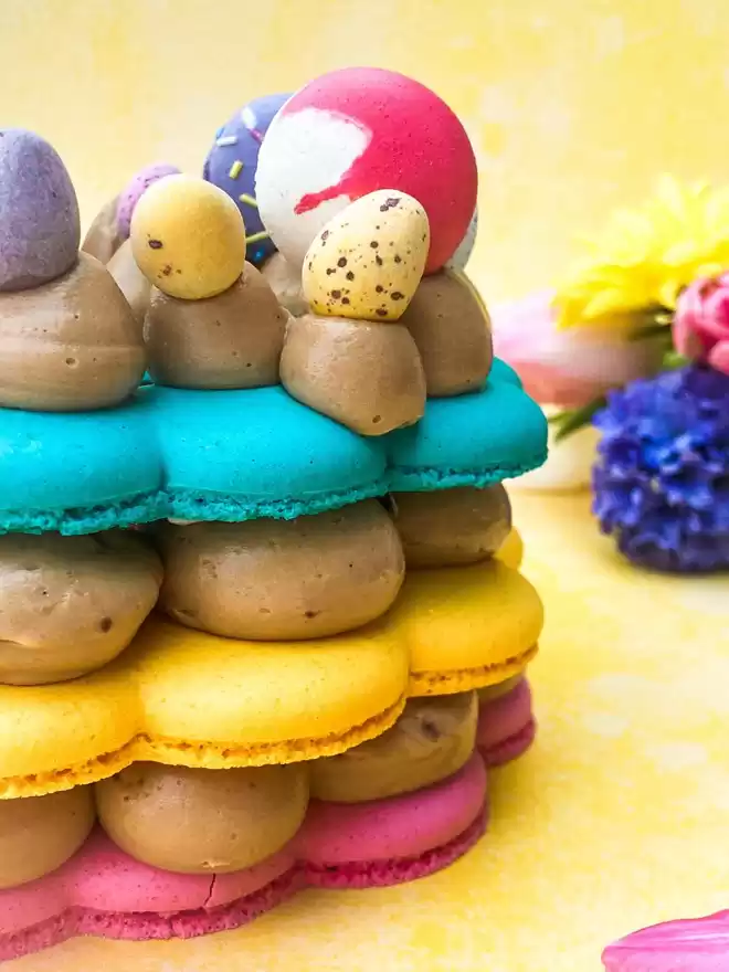 colourful DIY macaron stack cake with mini eggs