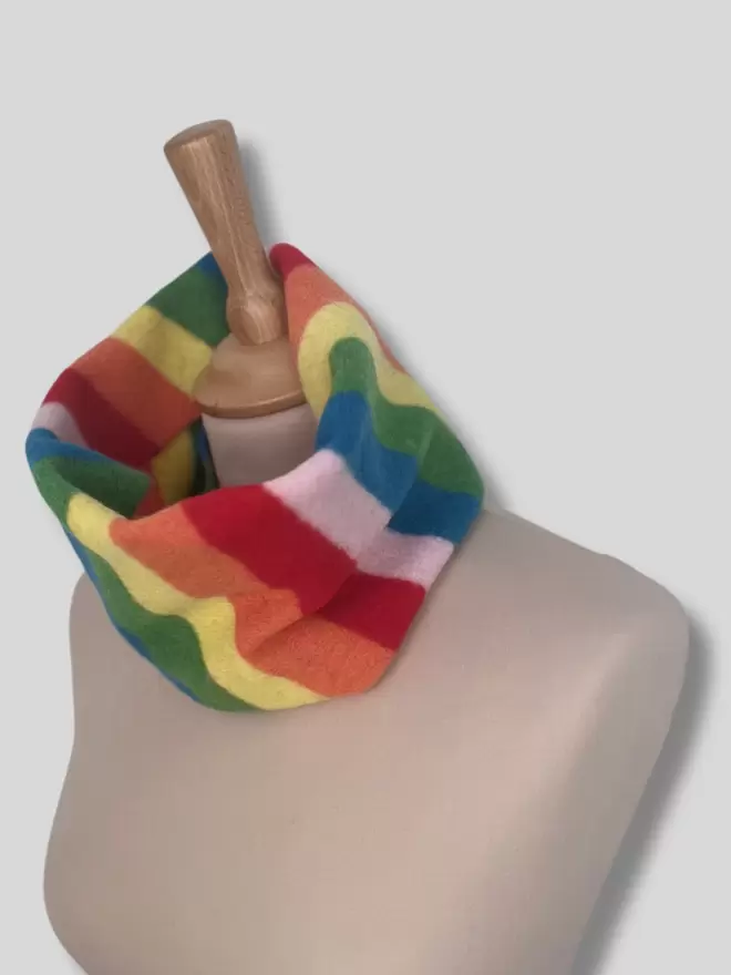Rainbow knitted snood shown on a mannequin