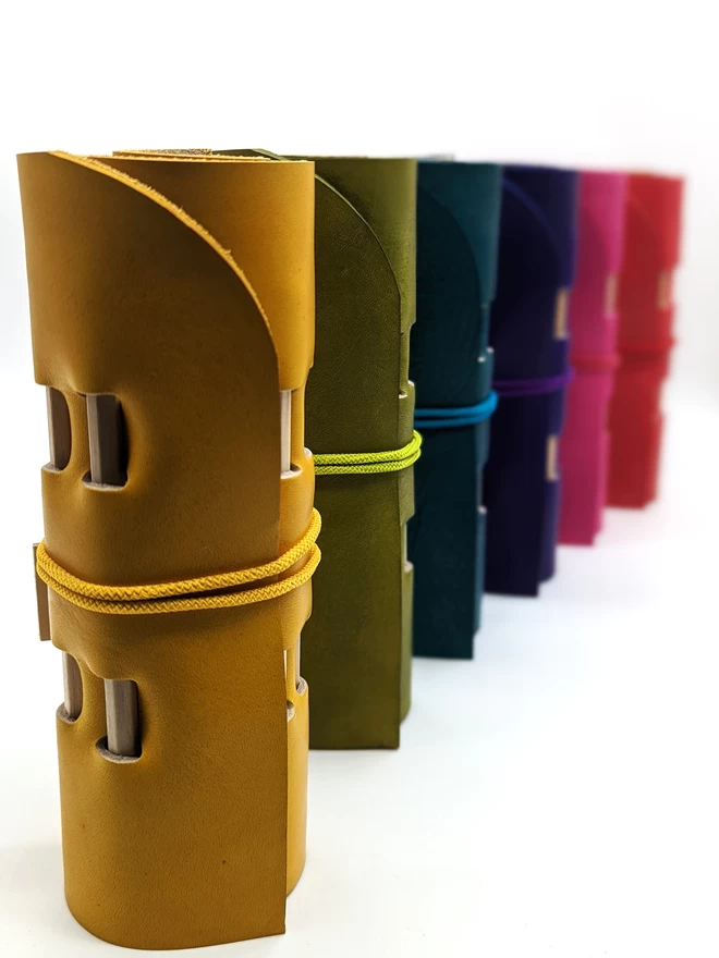 Rolled leather pencil rolls viewed from the side