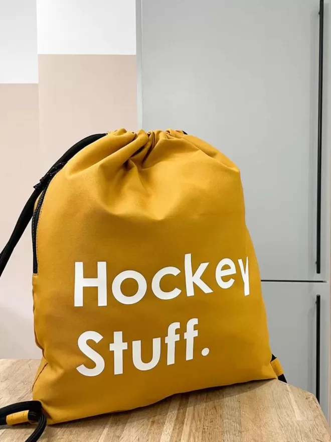 Hockey stuff personalised waterproof drawstring bag in mustard