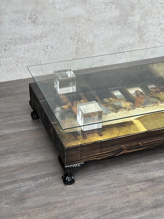 glass top coffee table with last supper image on surface