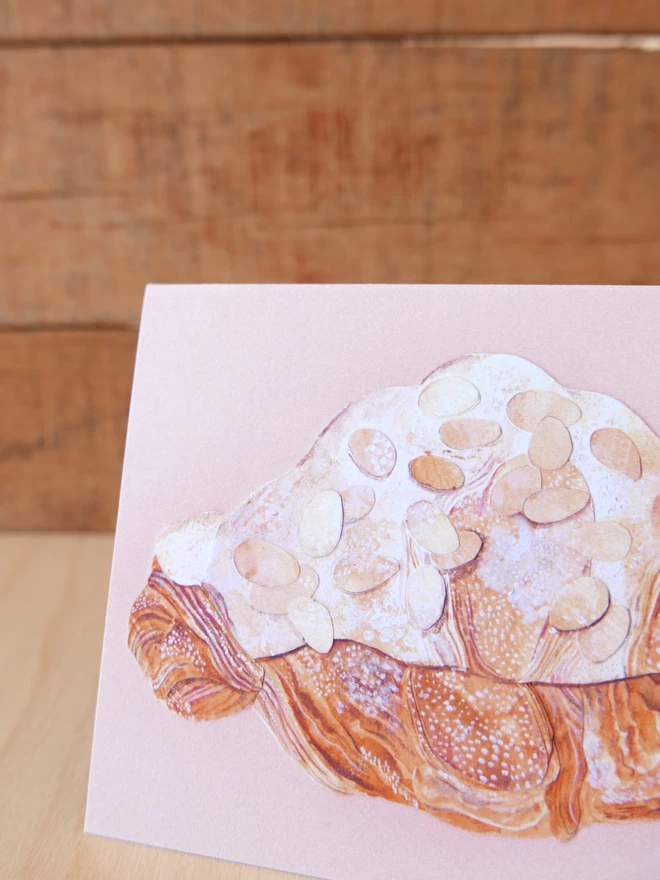 Close up of an the Almond Croissant Card showing the detail of the illustration 