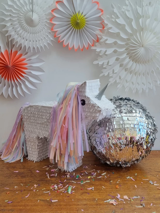 Disco ball and unicorn pinatas ready to party custom made by pinyatay