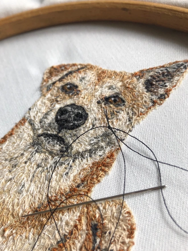 close-up of the making of a small embroidered pet portrait