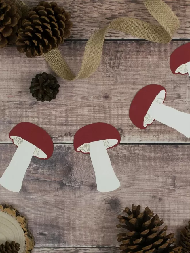 Mushroom Paper Bunting displayed on wooden background
