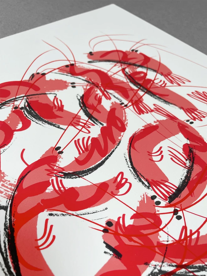Close up of a muddle of funny happy prawns jumping around the page with squiggles for shells and wild antennae, screenprinted in salmon pink with little black dots for eyes and bits of shading. 
