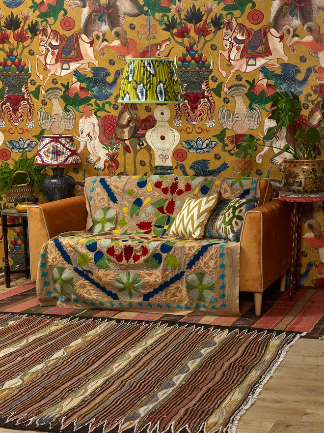 Maximalist Interior Design: Two Handmade Silk Ikat Lampshades in a Yellow-Styled Patterned Wallpapered Room