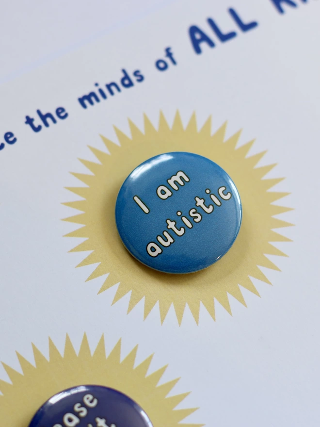 An 'I am autistic' badge on its backing card