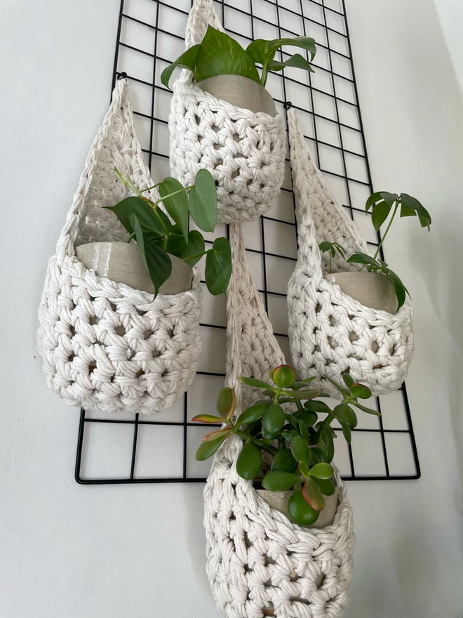 indoor large white cotton hanging wall planter, white fabric wall mounted plant holder, handmade crochet plant basket, handmade sustainable crochet decor, rustic natural organic homeware accessories, hanging plant pot holder