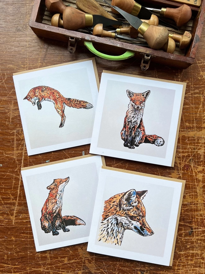four fox cards linocut and watercolour