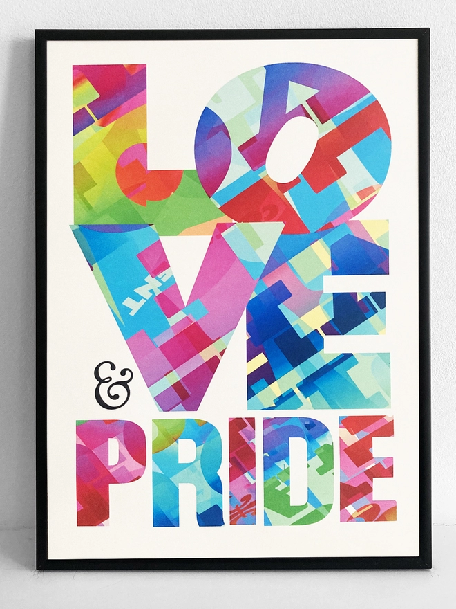 Framed multicoloured typographic print of “Love and Pride”