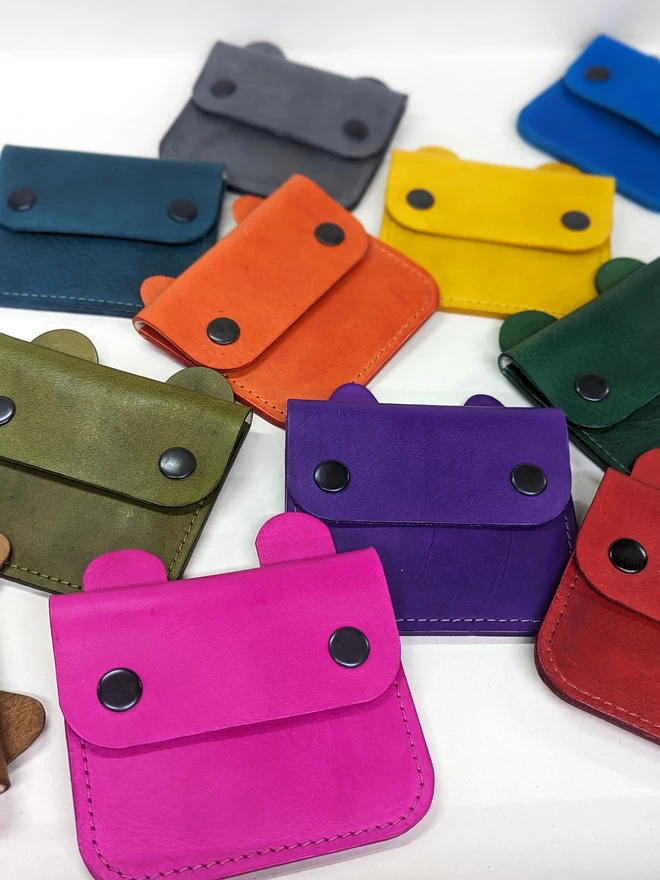 Assorted Notch Handmade leather animal purses in a variety of colours.