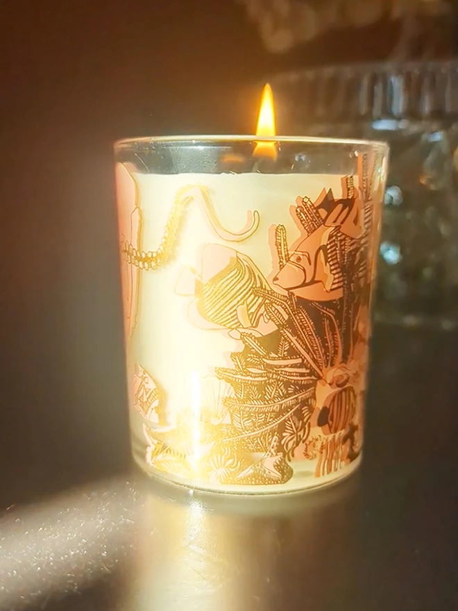 Angels of the deep neroli charity candle in a reusable glass with pink & gold illustrations