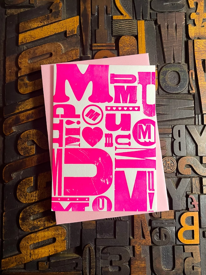 A letterpress print made for your "M-U-M". Perfect for Mother's day. These cards are printed with my own fair hands on my 1915 Arab Crown Folio Press. The card is hand-fed into the press for each of the three colour passes. Printed using vibrant translucent and metallic inks using a deep impression print. Printed on the finest Colorplan Pristine White thick 350gsm double-sided card with a range of matching colours of Colorplan 135gsm self-seal envelope; recognised as one of the best double-sided coloured cards on the market, Colorplan is manufactured from 100% virgin ECF fibre. Also available in a Father's Day design.
