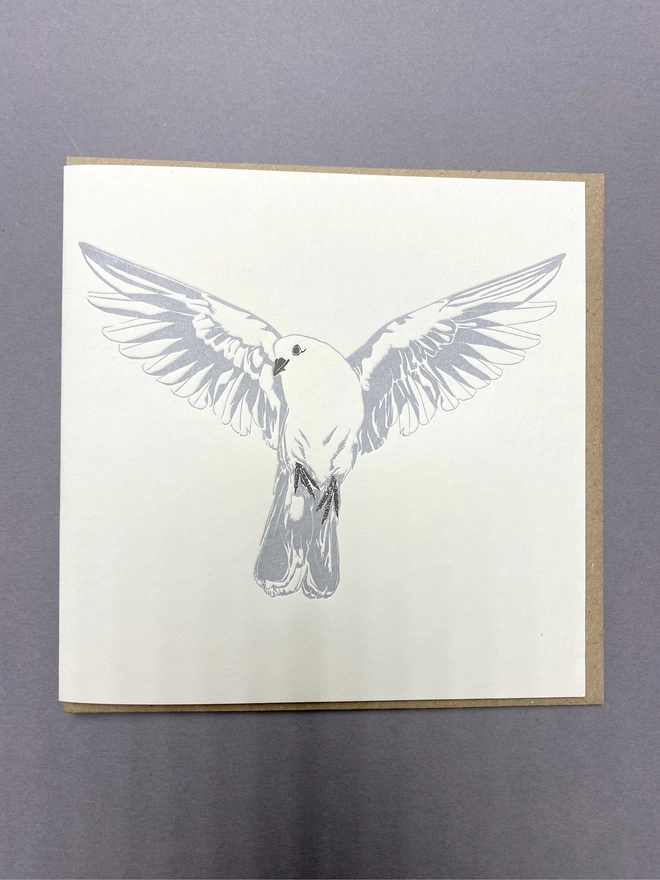 Full image of the letterpress printed dove card with and envelope inside
