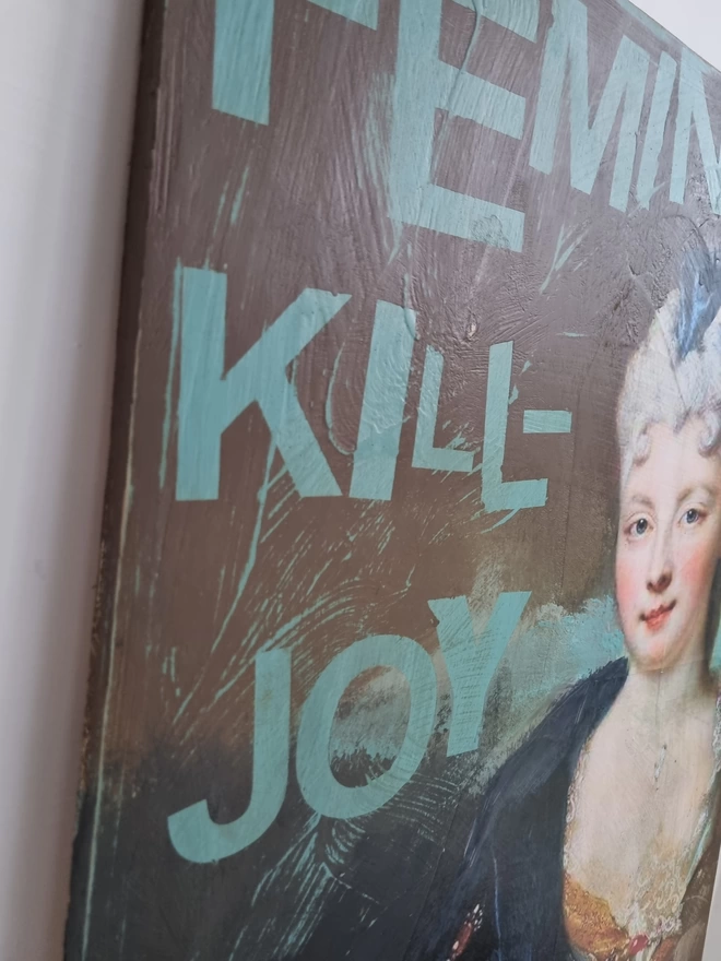 Painted and decoupage art panel featuring an antique portrait of an aristocratic lady and duck egg blue wording that reads ‘feminist kill-joy’