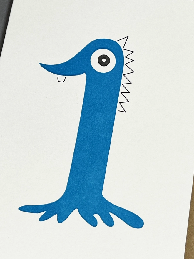 Close up of the blue neon number one Children's birthday card with one eye and one tooth