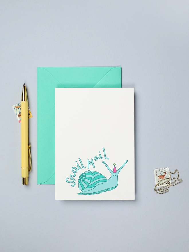 Colourful birthday card featuring a bright slow snail