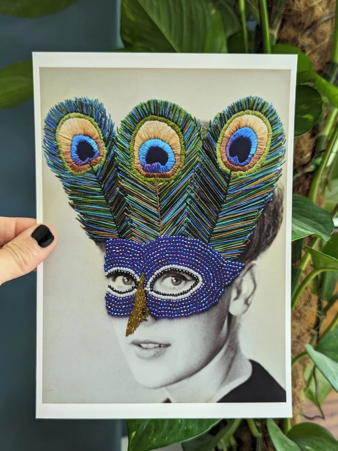 Black and white photograph print, women wearing embroidered peacock mask