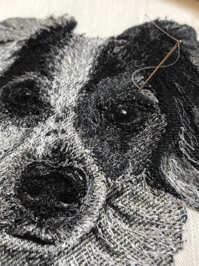 close-up of the making of an embroidered pet portrait