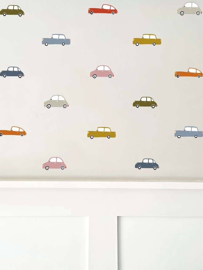 Retro car wall stickers on painted wall above white wall panelling