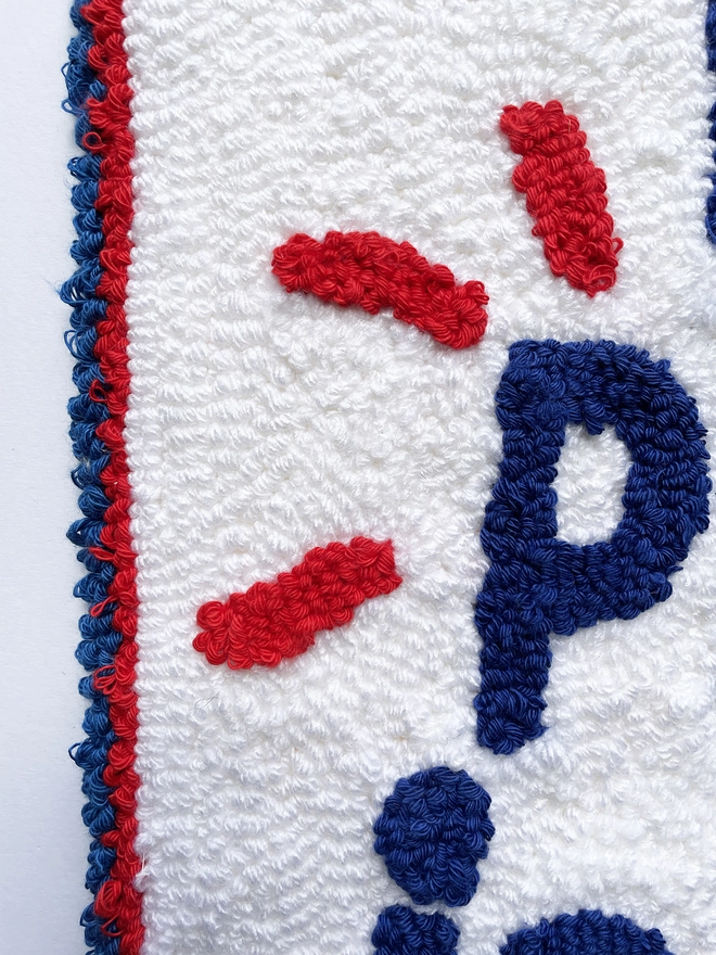 close up of "OK" with the blue, red and white Pepsi logo in the 'P' of "Pepsi"