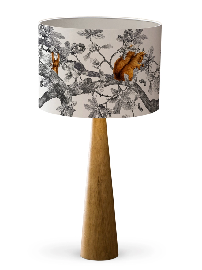 Drum Lampshade featuring Red Squirrels with a white inner on a wooden 