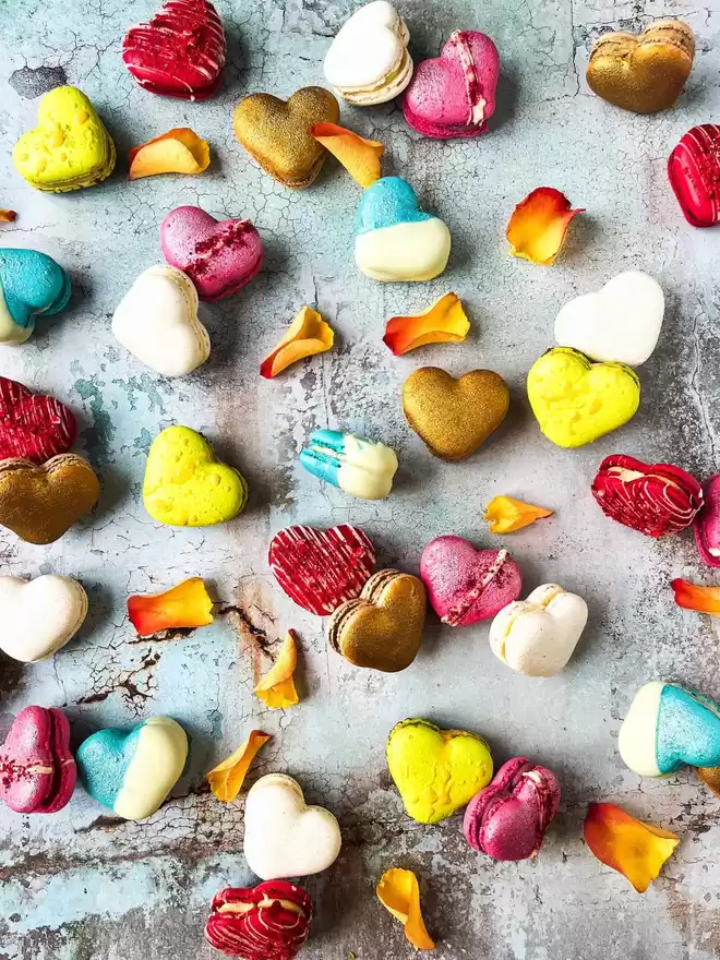 colourful heart shaped macarons arranged in a heart shape