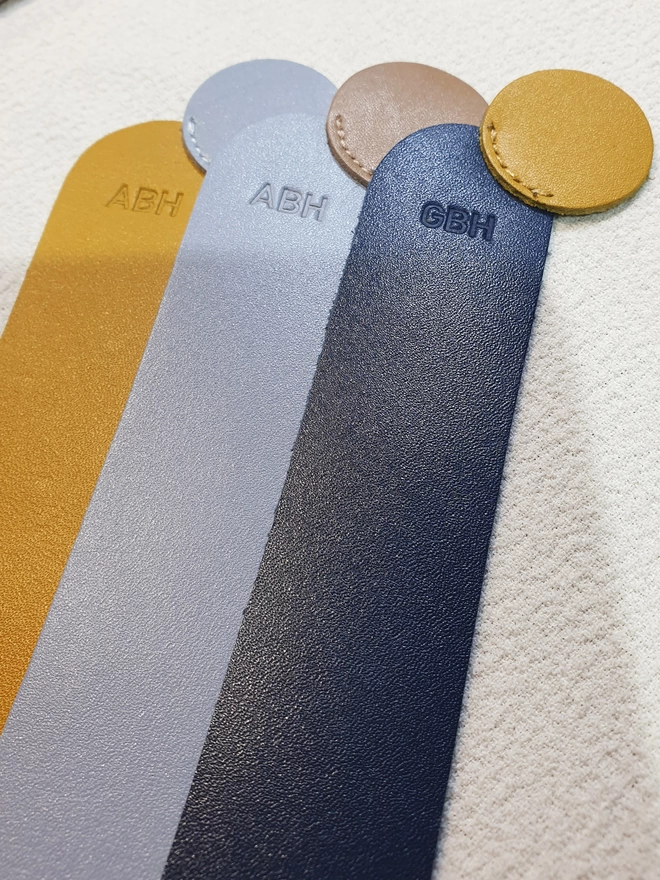 Photo showing the bookmarks with personalisation. It reads GBH, ABH and ABH on each one.