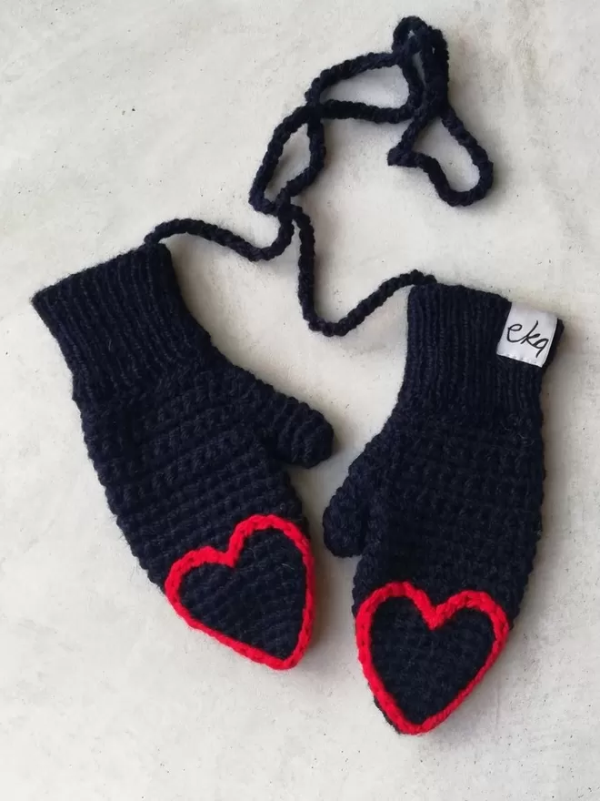 EKA heart tipped mittens in blue and red.