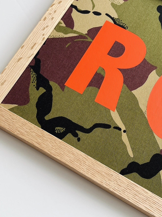 Personalised framed camouflage word/name picture close up of orange lettering