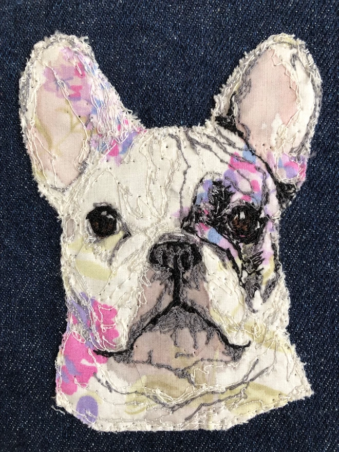 detailed closeup of embroidered pet portrait of a French bulldog