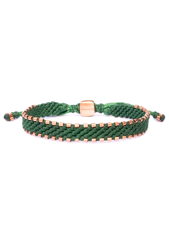 green rope and copper bracelet