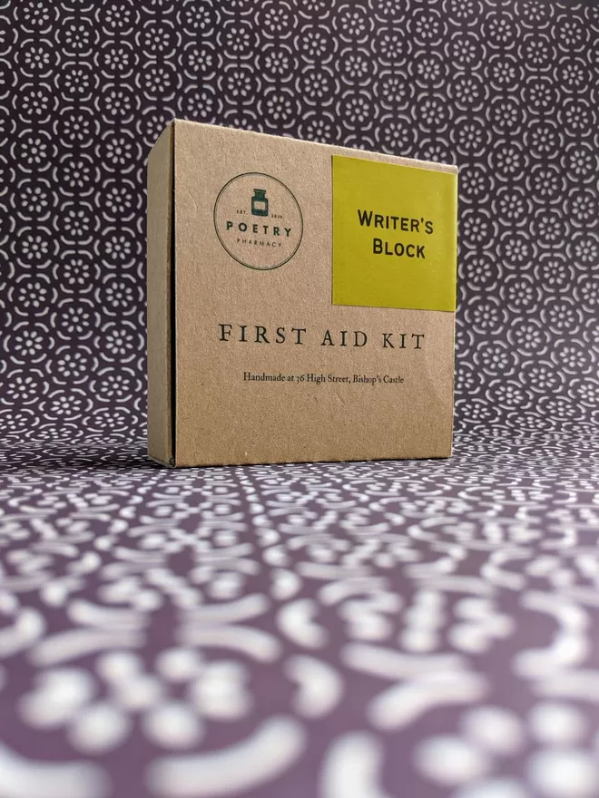 Closed Writer's Box First Aid Kit on patterned background