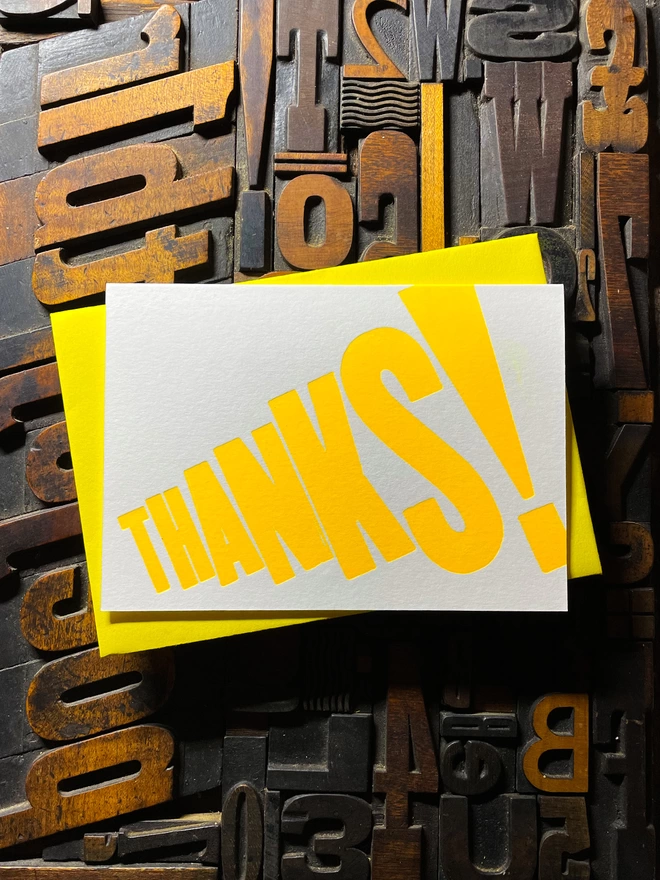 Thanks! A vibrant thank you typographic letterpress card with deep impression print using fluorescent yellow, with a range of colourful envelopes. Slight print variations adding to the style anding to the charm of this handmade greeting card.
