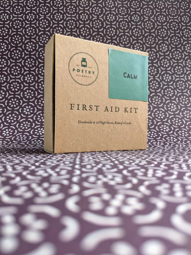 Calm First Aid Kit, closed, on patterned paper