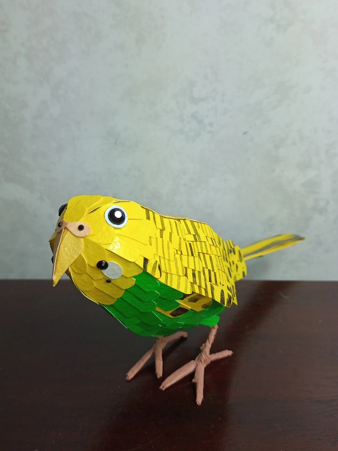 yellow and green budgie sculpture