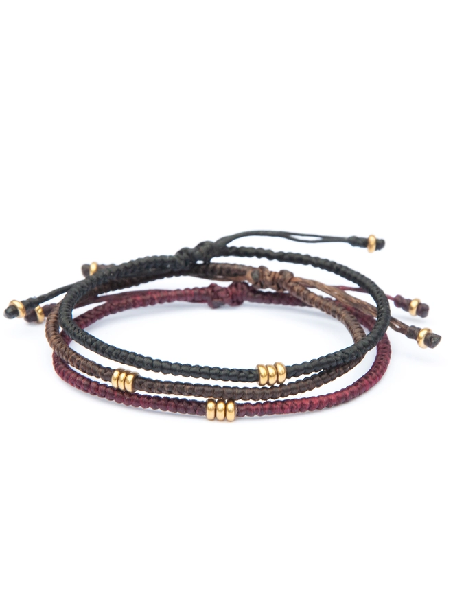 black, red and brown bracelets