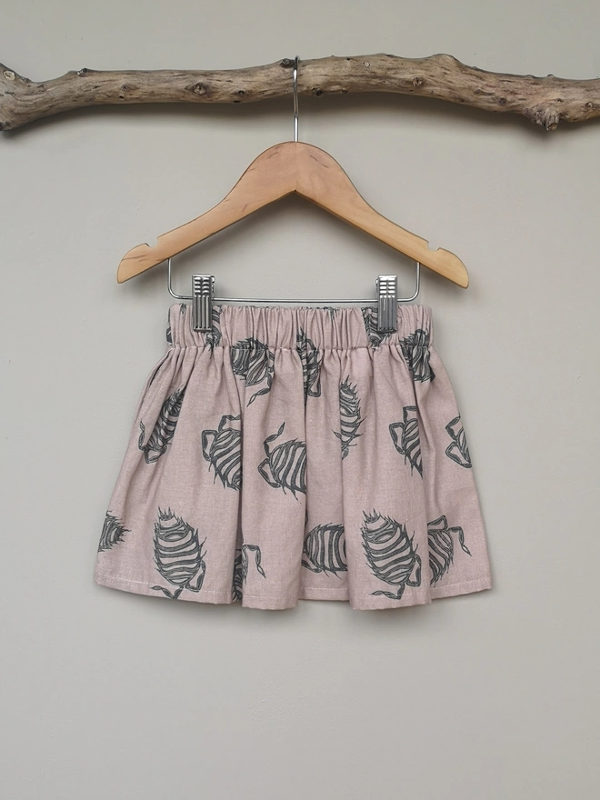 Girls Cotton Linen Pink Woodlouse Print Skirt. Elasticated Waist and Side Seam Pockets.