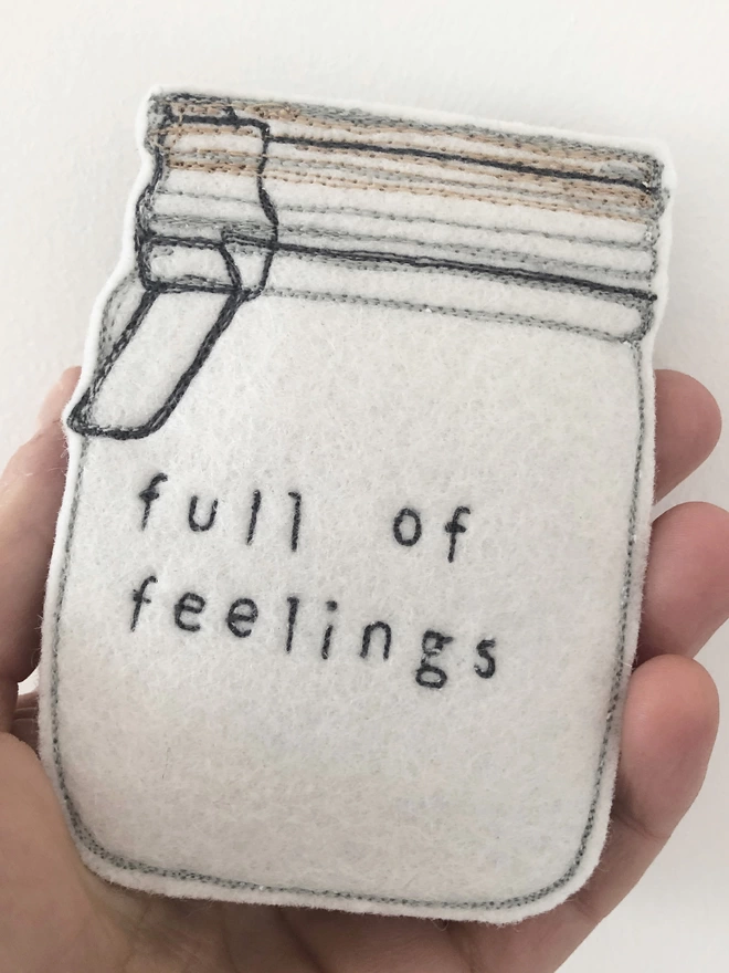 Jar Full of Feelings being held