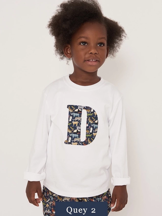 Childrens T-shirt in white with initial on the front in Quey 2  Liberty print fabric