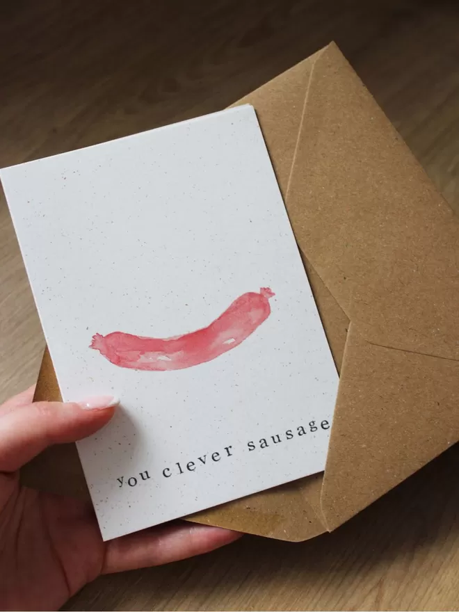 'You Clever Sausage' Card being taken out of Kraft envelope
