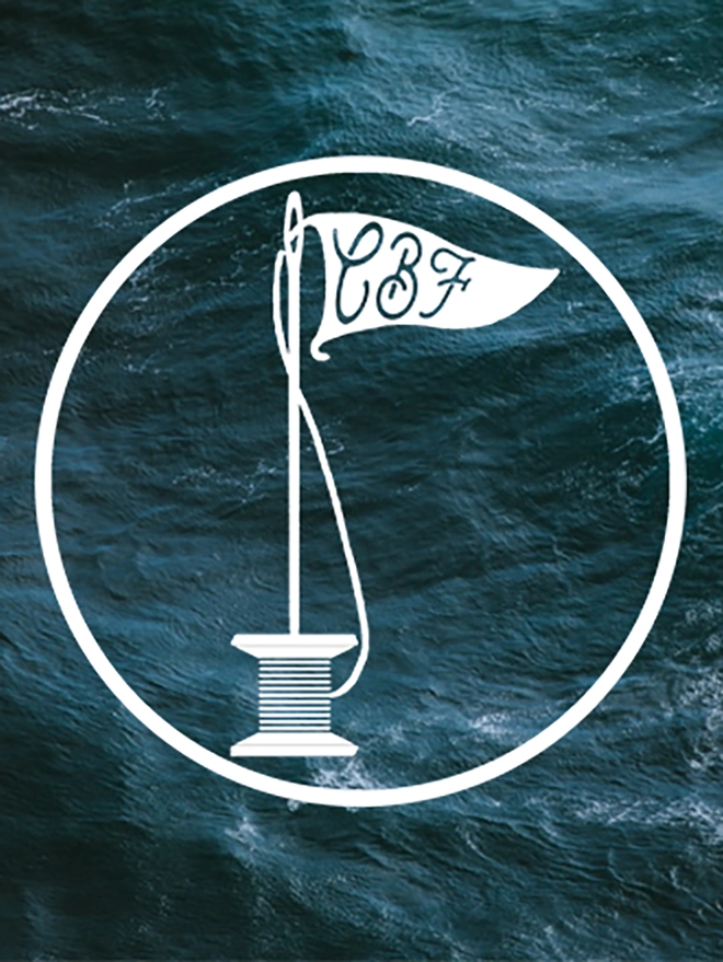 Caro B Fin Studio logo on a background of a dark green sea.