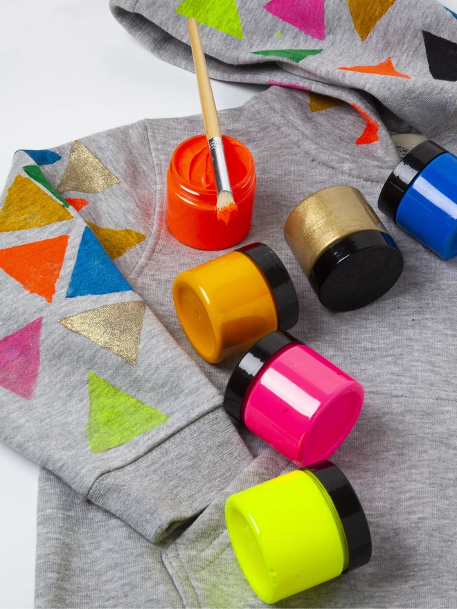 Stencilled coloured shapes onto hoody