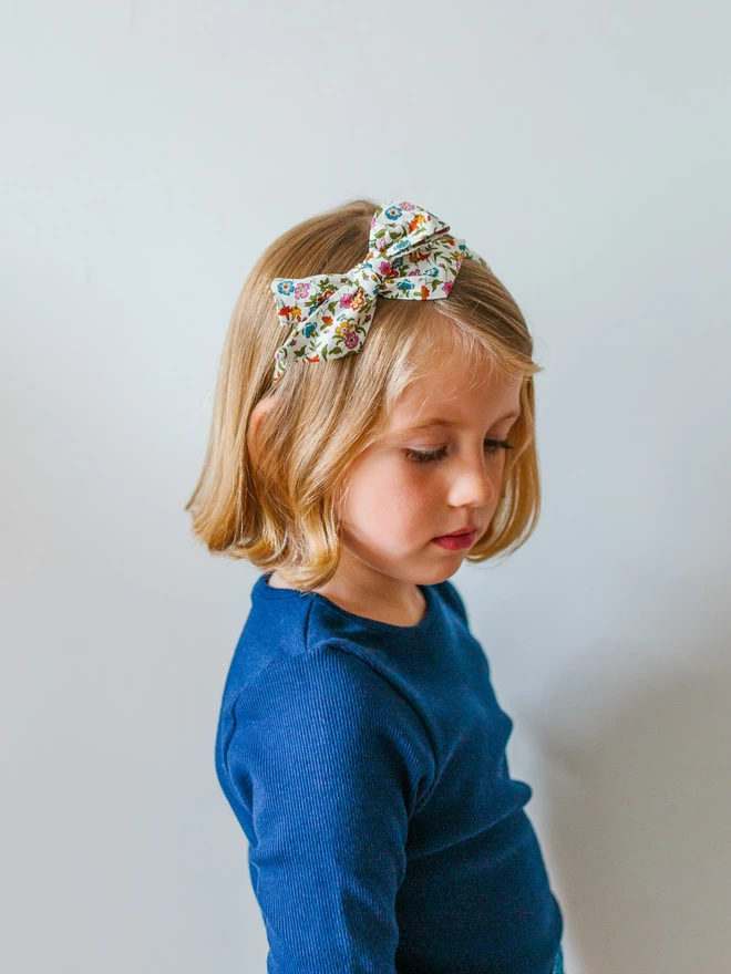 Blonde girl with a liberty hair bow