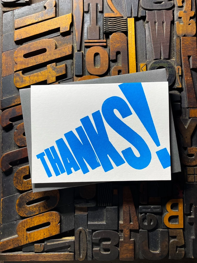 Thanks! A vibrant thank you typographic letterpress card with deep impression print using fluorescent blue, with a range of colourful envelopes. Slight print variations adding to the style anding to the charm of this handmade greeting card.