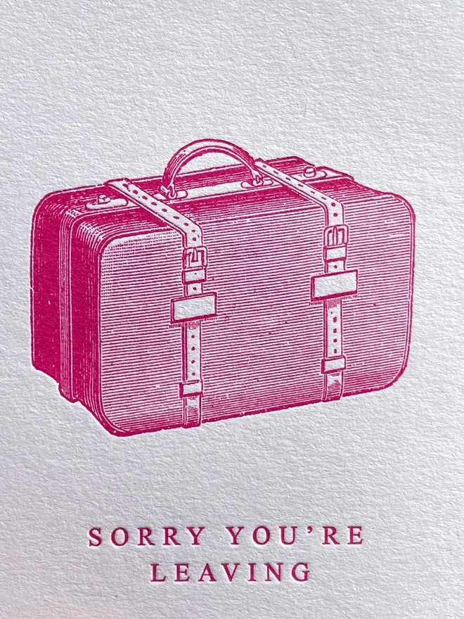 White card with pink illustration of a bag with text reading 'Sorry you're leaving'